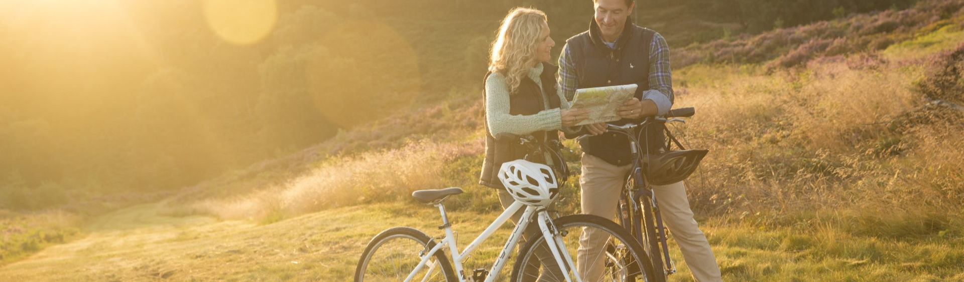 Biking couple looking at a map